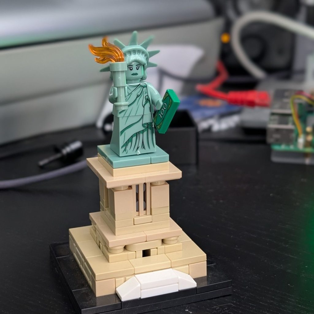 Victor lost the book that used to be in the left land of the Lego Statue of Liberty. When I pointed that out he said he had something we can replace it with. He came back with a Lego 100 dollar bill a